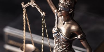 Closeup of a sculpture of Themis, mythological Greek goddess, symbol of justice,